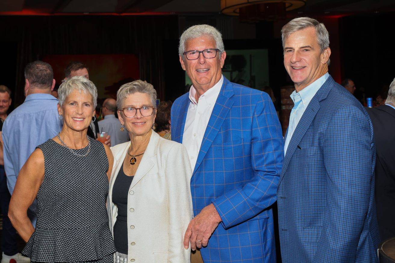 Perrotty and Oxholm family posing for photo at Cokctails & Classics.
